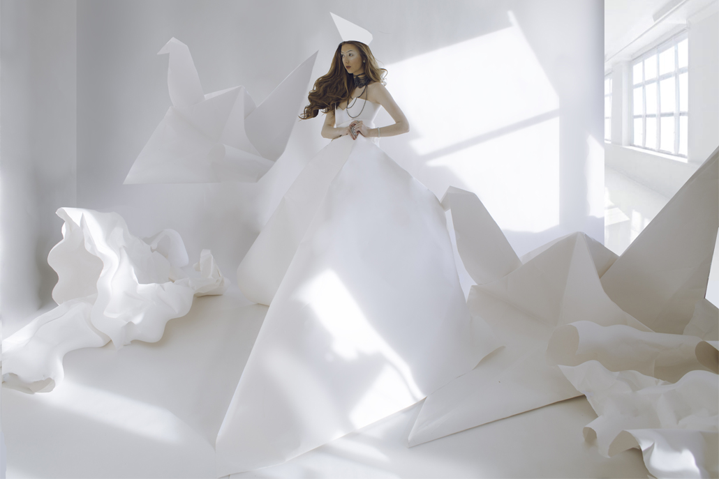 ﻿Woman wearing white original dress in room with window